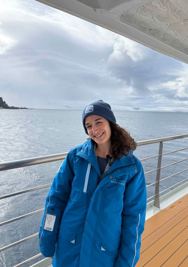 woman similing with stunning background of antarctica landscape